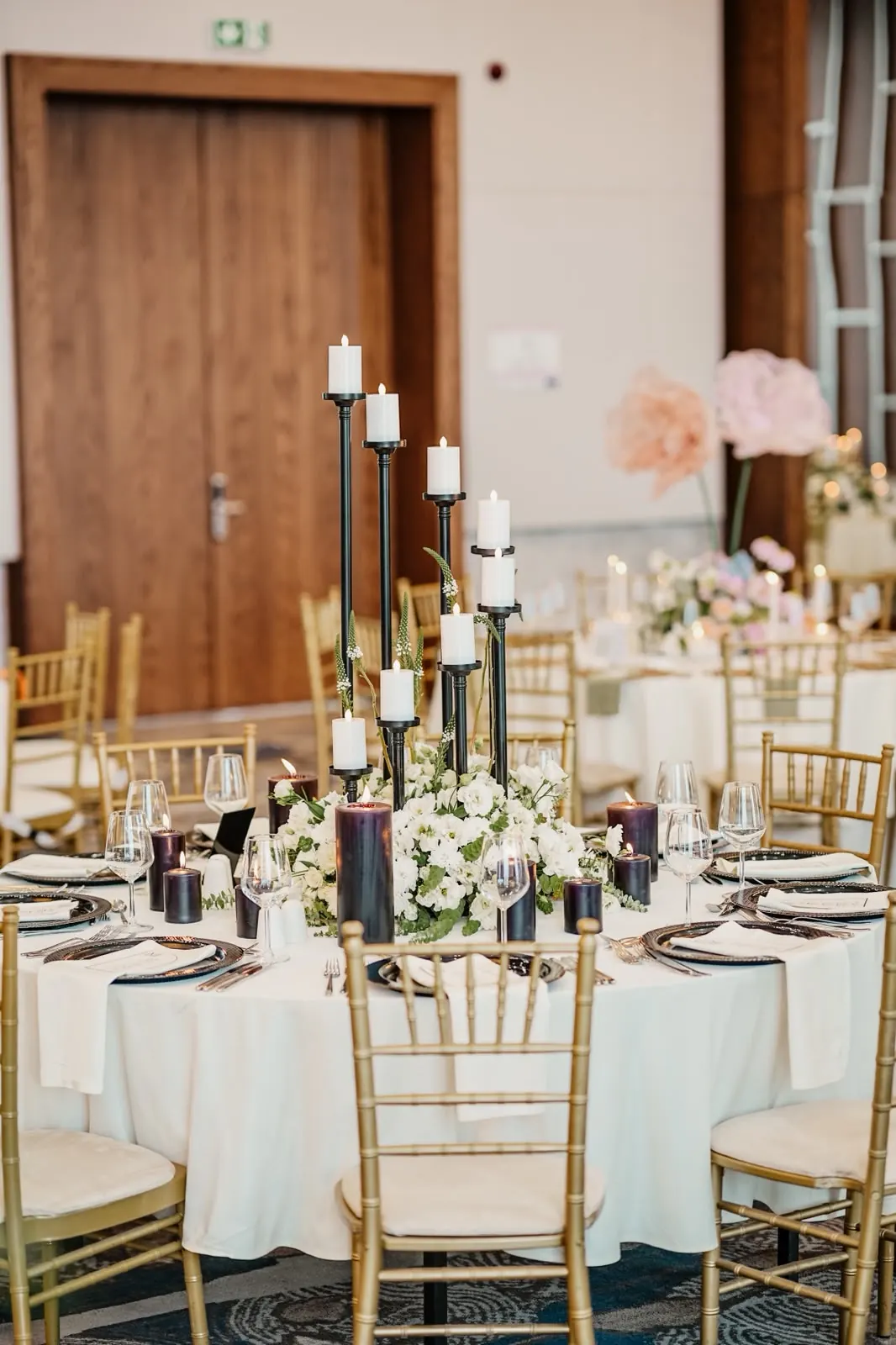8 Head Rotating Candelabra with white flowers on a wedding table