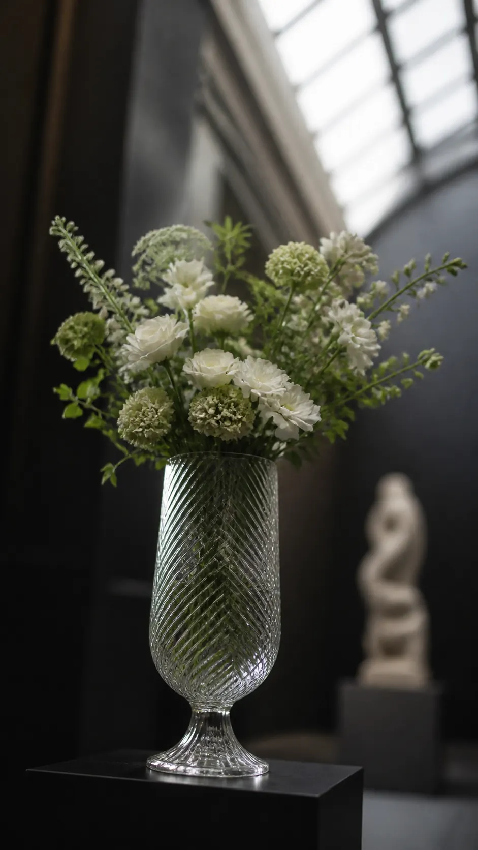 Maha Vase with a white and green floral arrangement