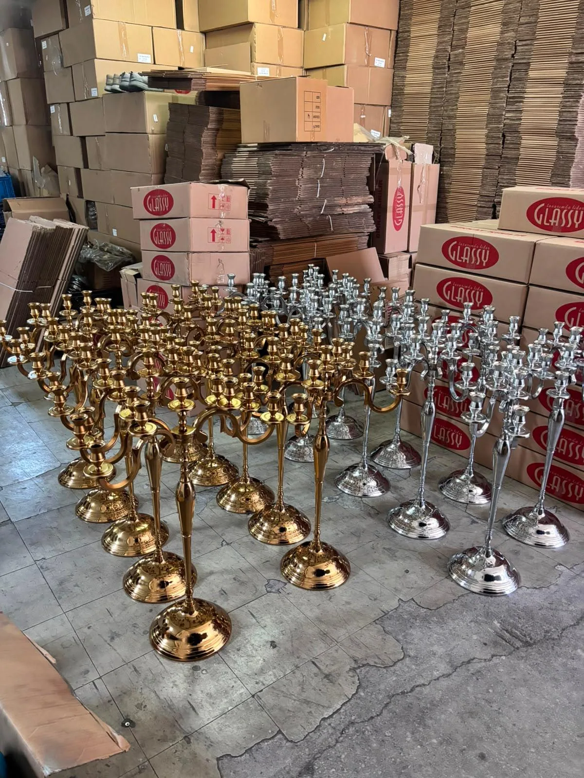 Rental candelabras inspected and counted before a wedding delivery